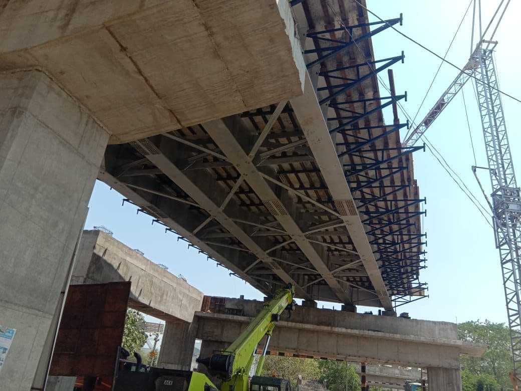 Girder erection beneath a flyover deck