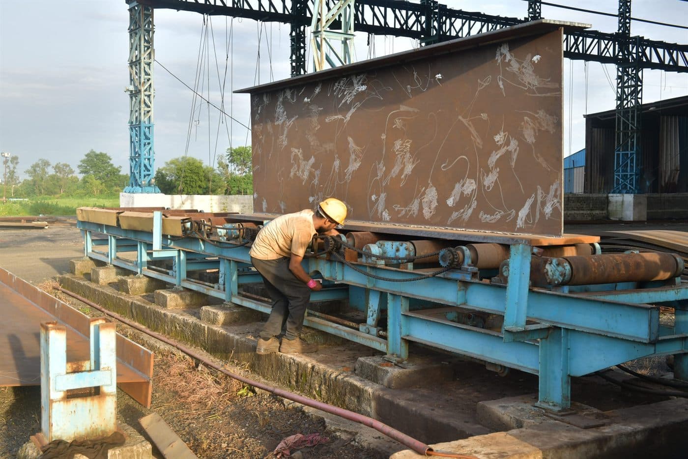 Steel plate being handled on the roller line
