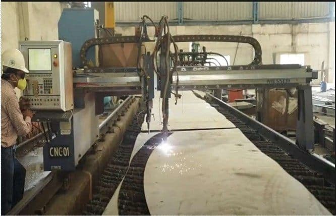 CNC plate cutting machine profiling a steel plate