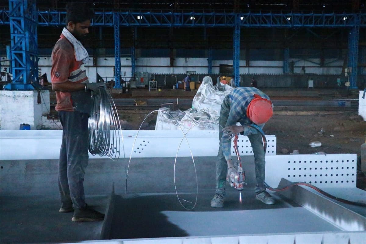 Metalizing and spray coating of fabricated girders