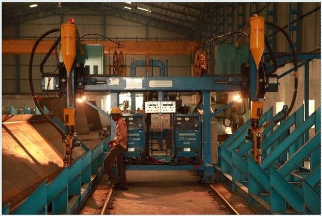 Submerged arc welding stations inside the fabrication bay